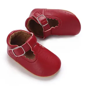 Detailed view of red soft sole baby Mary Jane walking shoes with scalloped edges