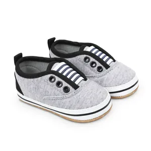 Grey soft-soled infant walking shoes for 0-1 year olds with striped detail