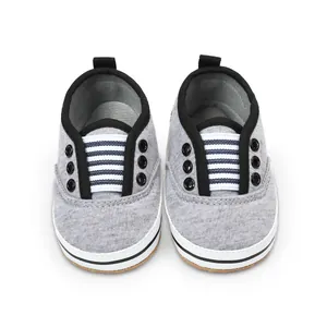 Top-down view of comfortable grey striped infant walking shoes with flexible soft soles