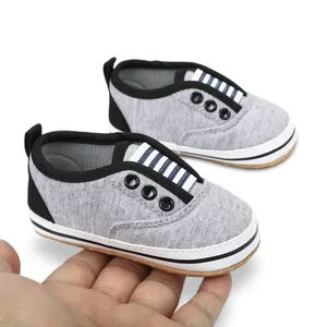 Soft sole grey baby walking shoes with striped detail for 0-1 year old infants.
