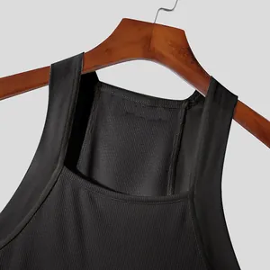 Close-up of black ribbed men's tank top showing neckline and shoulder strap detail