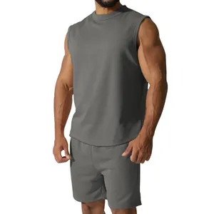 Detailed view of the dark gray sleeveless sports set showing the muscular athletic fit