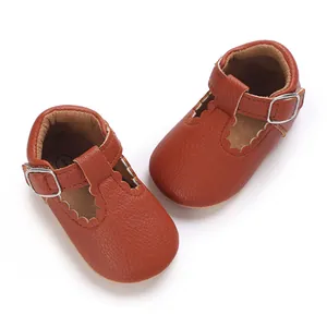 Detailed view of brown leather soft-sole baby walking shoes for infants and toddlers.