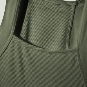 Macro detail shot showing the fine ribbed texture and neckline of an olive green men's vest