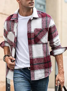 Macro view of men's red plaid flannel shirt featuring a classic lapel and soft texture