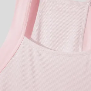 Close-up detail of pink ribbed fabric on a men's slim fit tank top vest.