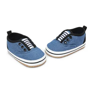 Casual blue denim baby walking shoes with striped elastic laces and non-slip soles.