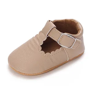 Close-up detail of beige baby Mary Jane walking shoe with soft sole and scallop edge trim