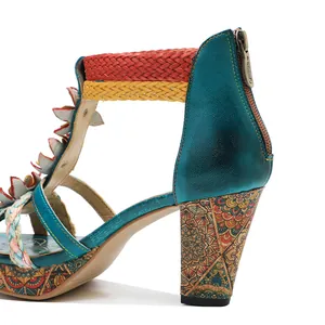 Detail of retro leather sandal with colorful braided straps and patterned high heel