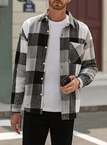 Detailed view of a men's black and white plaid flannel shirt featuring a pocket