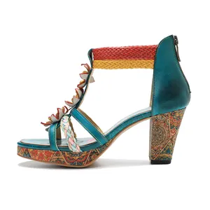 Side view of bohemian leather high-heeled sandal with floral and woven details