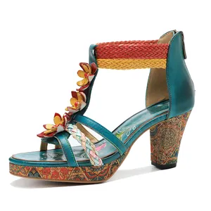Side view of vintage leather high heel sandal with floral appliques and woven straps