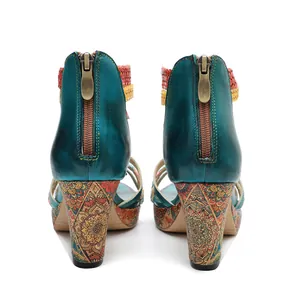 Back view of vintage handmade leather high heel sandals with ethnic print and rear zipper