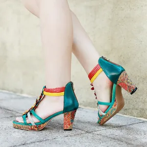 Vintage handmade leather sandals with colorful braided straps and patterned heels.