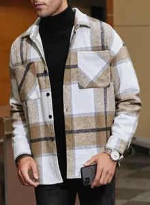 Close-up detail of men's brown plaid flannel shirt showing chest pocket and texture