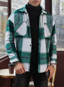 Casual mens green and white plaid flannel shirt with long sleeves and dual chest pockets