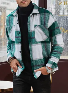 Detailed view of men's green and white plaid flannel long sleeve shirt in a loose fit