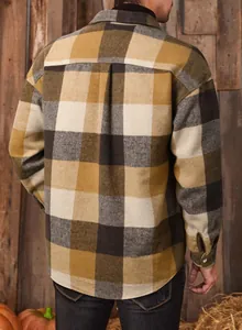 Back view of men's loose plaid flannel shirt in mustard and black checkered pattern