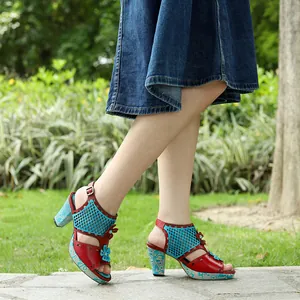 Side detail of vintage genuine leather hollow-out high heel sandals with floral accents