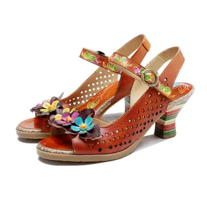 Side view of handmade vintage leather sandals with colorful 3D flowers and cutouts.