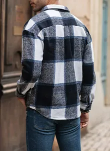 Back view of men's loose long-sleeve plaid flannel shirt in navy and white