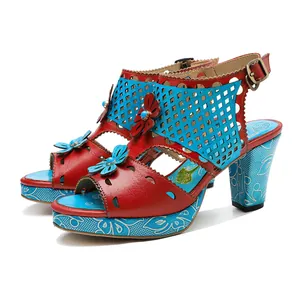 Detailed side view of vintage handmade leather floral sandals with hollow-out design