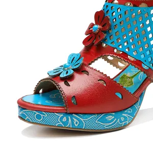 Close-up view of vintage leather high-heel sandal with floral accents and hollow design.