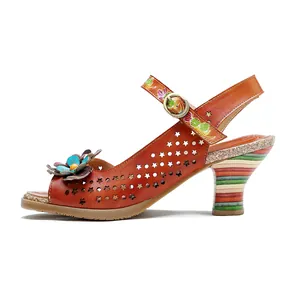Detailed side profile of handmade leather high heels with hollowed floral design