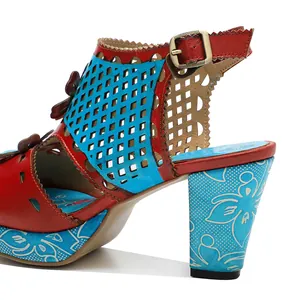 Detailed view of vintage handmade leather sandals with hollow-out design and floral printed heel