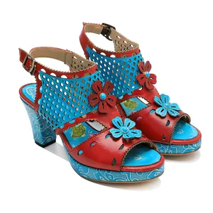 Detailed view of vintage genuine leather sandals with floral applique and cut-out design