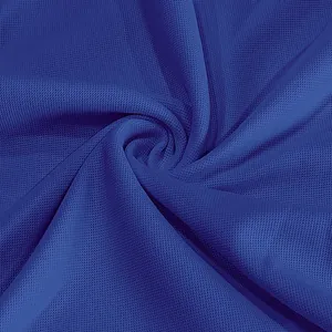 Close-up macro view of blue quick-dry breathable mesh fabric texture for polo shirts