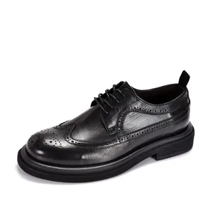 Detailed side view of classic black genuine leather Brogue shoes with wingtip carvings.