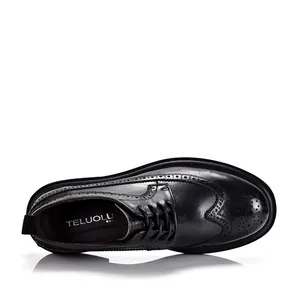 Classic black leather Brogue shoes for men featuring vintage wingtip carving detail