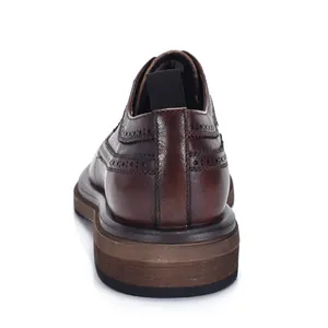 Rear view of premium dark brown leather Brogue shoe with detailed stitching and pull tab