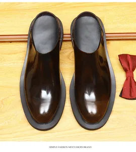 Detailed top view of men's brown glossy leather mules with a vintage gradient finish
