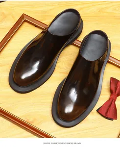 Detailed view of glossy burnished leather mules in classic British style