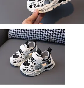 Detailed view of breathable children's hollow-out sports sandals with chunky sole.