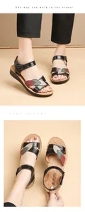 Close-up detail of comfortable genuine leather sandals for women with colorful leaf design