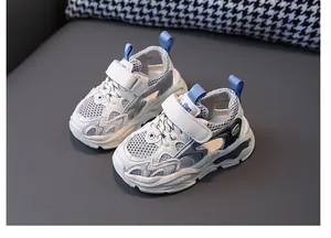 Breathable hollow children's sports sneakers in white and blue with adjustable straps