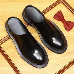 Glossy black men's backless leather loafers with thick soles and classic round toes