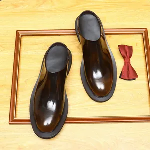 Men's glossy brown burnished leather backless loafers with chunky sole and round toe
