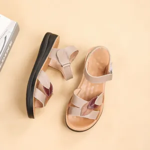 Elegant women's genuine leather sandals featuring soft soles and a stylish leaf pattern design