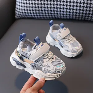 Breathable hollow-out kids' sports sandals with velcro closure and chunky soles.