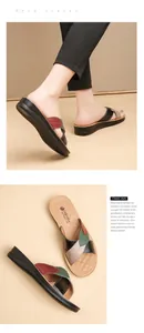 Detailed close-up of women's multi-color leather flat sandals with massage insole