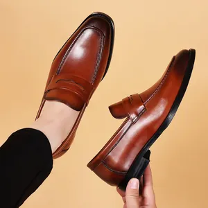 Classic brown genuine leather penny loafers for men with breathable slip-on design