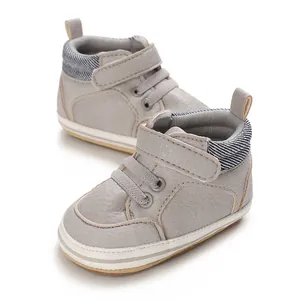Grey high-top baby walking shoes with soft rubber soles and hook-and-loop strap