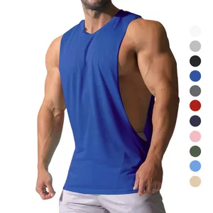 Muscular man wearing a royal blue deep cut side tank top for gym training