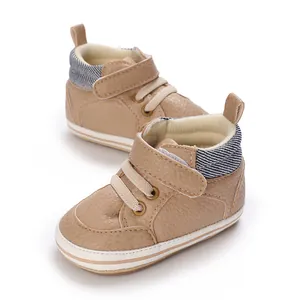 Detailed view of tan high-top baby pre-walker sneakers with soft sole and stripes
