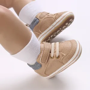 Close-up detail of khaki high-top baby walking shoes with soft non-slip sole for infant