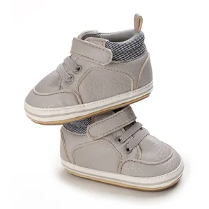 Detailed view of grey baby high-top walking shoes with rubber soles for 0-1 years